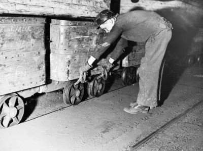 Ashington Coal Company: Young Man Pulling Coal Tub onto Rails, 1900s