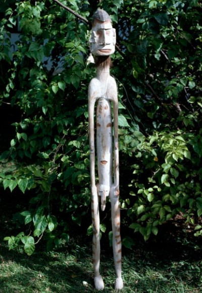 A selection of carved figures, canoe prows and ornaments from the Asmat tribe of Irian Java, the Indonesian part of New Guinea.