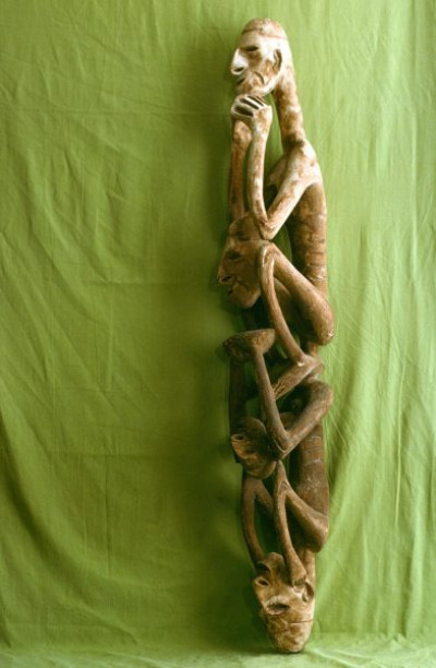 A selection of carved figures, canoe prows and ornaments from the Asmat tribe of Irian Java, the Indonesian part of New Guinea.
