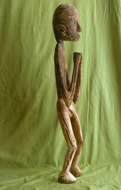 A selection of carved figures, canoe prows and ornaments from the Asmat tribe of Irian Java, the Indonesian part of New Guinea.
