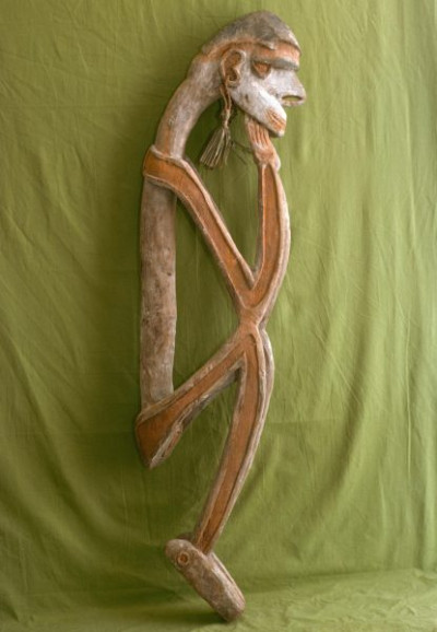 A selection of carved figures, canoe prows and ornaments from the Asmat tribe of Irian Java, the Indonesian part of New Guinea.