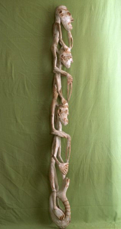 A selection of carved figures, canoe prows and ornaments from the Asmat tribe of Irian Java, the Indonesian part of New Guinea.