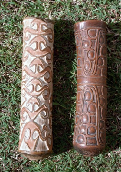 A selection of carved figures, canoe prows and ornaments from the Asmat tribe of Irian Java, the Indonesian part of New Guinea.