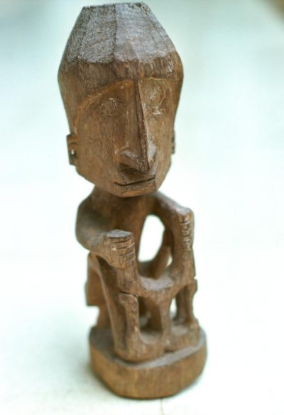 A selection of carved figures, canoe prows and ornaments from the Asmat tribe of Irian Java, the Indonesian part of New Guinea.