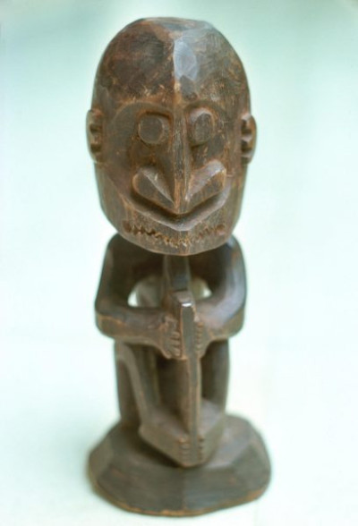 A selection of carved figures, canoe prows and ornaments from the Asmat tribe of Irian Java, the Indonesian part of New Guinea.