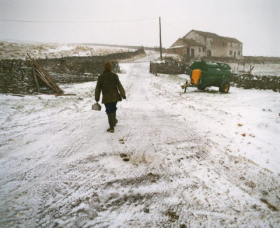 Unclear Family: Fetching hot water for frozen water pipes at the Betton farm, 1993
