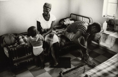 Bitter Harvest: Farm Worker Rubbing Cream on his Feet After Work, 1989